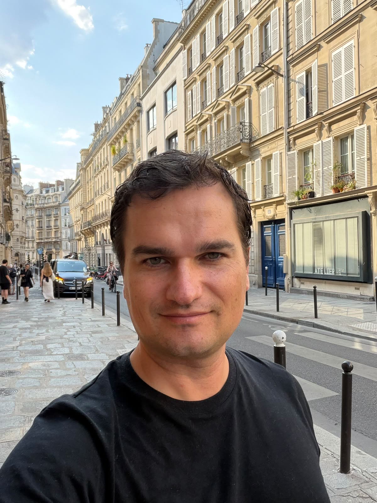 Tomáš, on a street in Paris