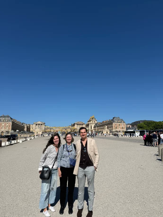 Visitors walking in the gardens at Versailles