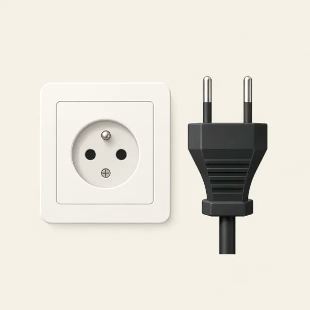 A Type C and E plug adapter of the kind used in France